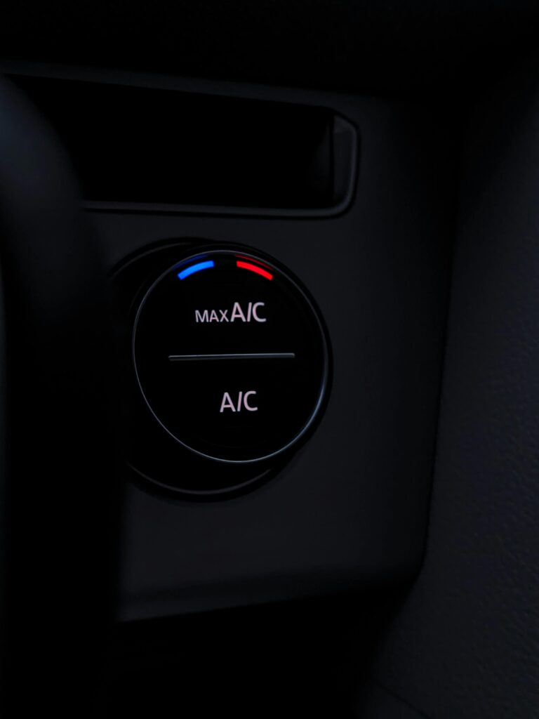 pexels-photo-10611959-10611959 Detailed view of a car air conditioning control knob, highlighting its modern design and functionality.